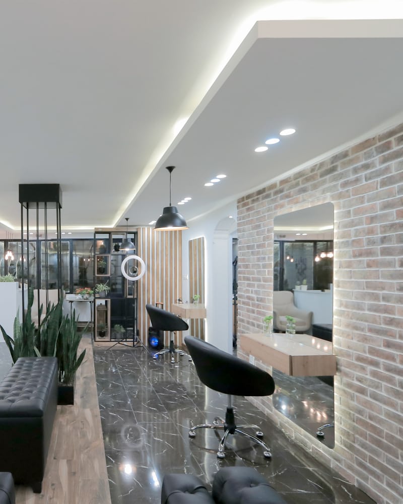 A salon interior with a central styling island